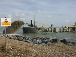 New shingle is brought to the beach by dredger during the summer.